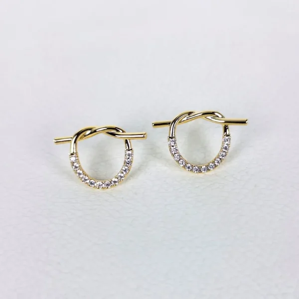 Knotty twist golden studs earrings