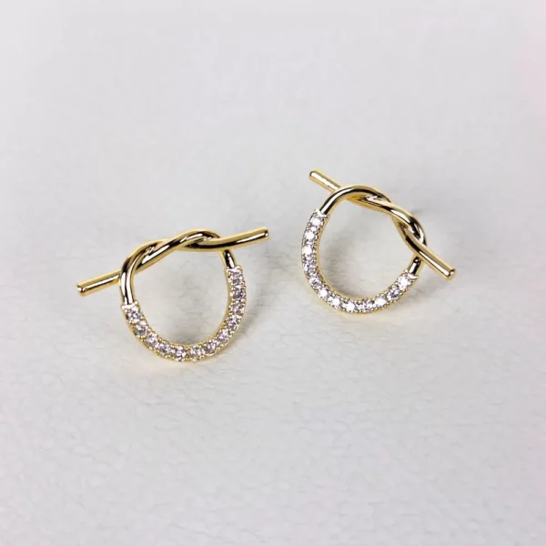 Knotty twist golden studs earrings